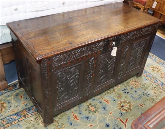 A mid 17th century oak coffer W.116cm